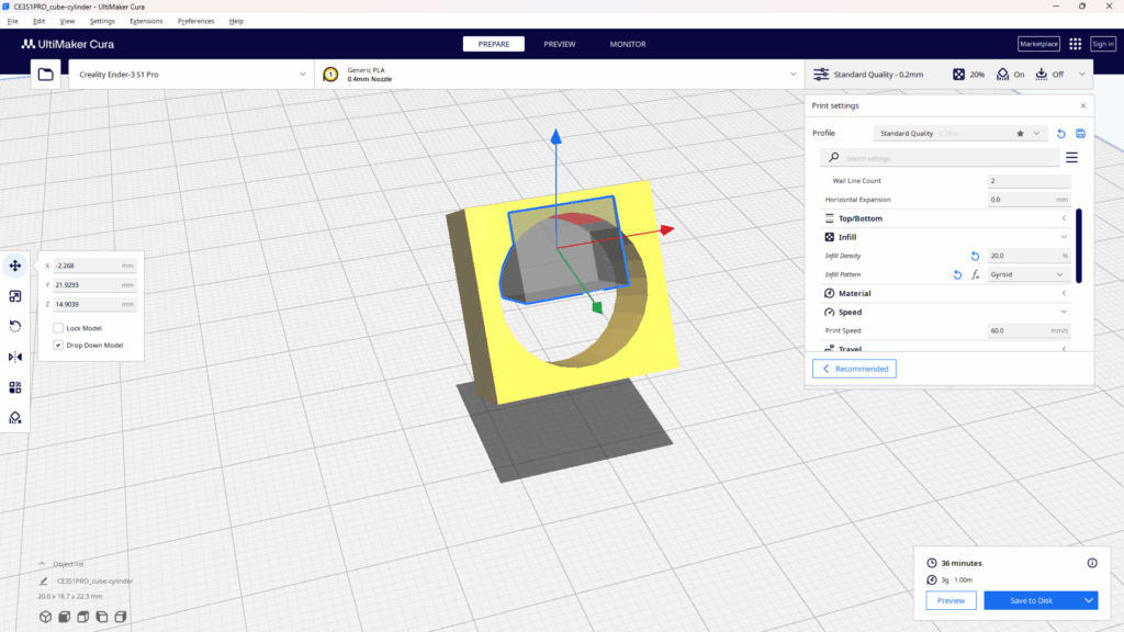 スライスソフトCuraで「サポートブロッカー」機能を使用している画面。黄色いモデルの中央にある穴の部分に、サポート材を生成させないための領域として、半透明なグレーの直方体（サポートブロッカー）を配置している。