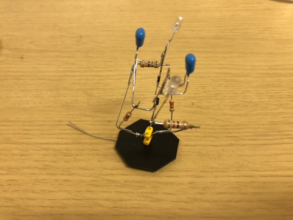 Astable multivibrator with resistors and LEDs installed using air wiring technique