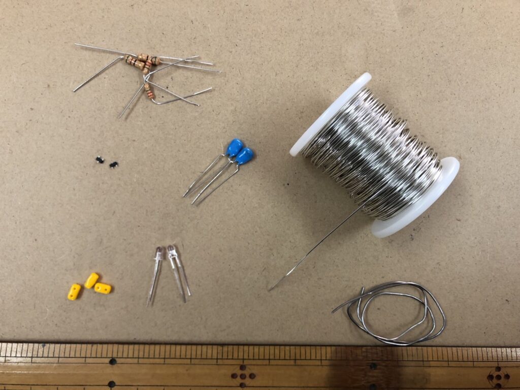 Electronic components used to build an air-wired astable multivibrator circuit