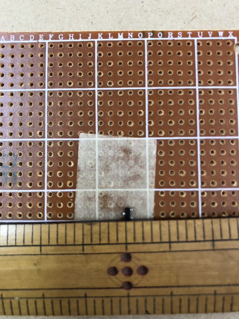 Surface-mount transistors fixed with double-sided tape for air wiring soldering preparation